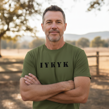 Man wearing olive Secret Squirrel IYKYK military t-shirt