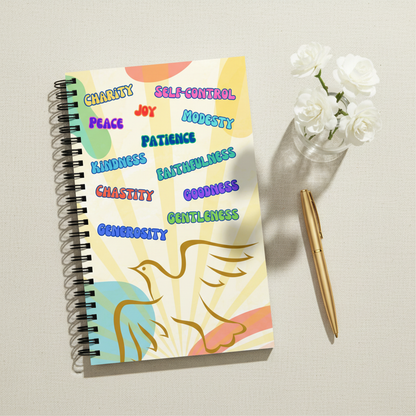 Styled flat-lay of Fruits of the Holy Spirit notebook with flowers and gold pen
