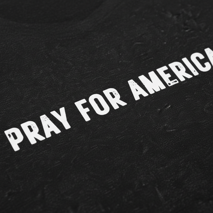 Close-up of Pray For America bold text and premium cotton quality