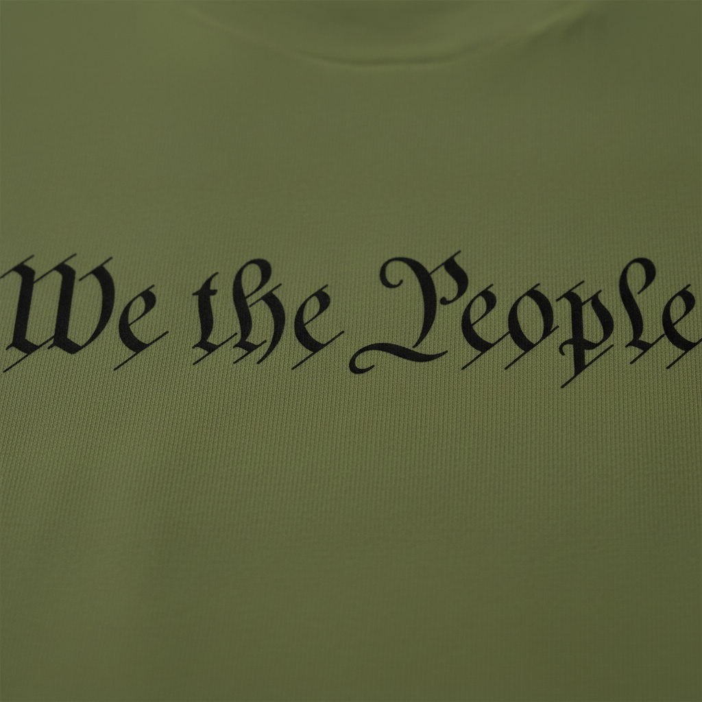 Close-up of We the People Old English script and premium cotton quality